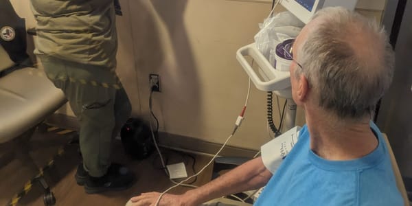 Dad sitting at the hospital